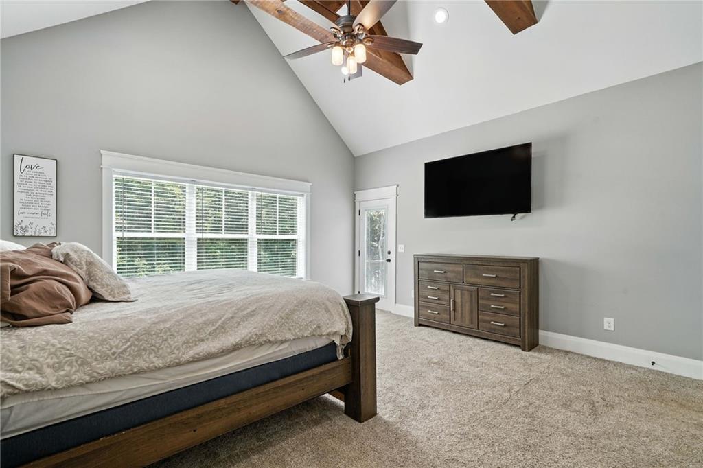 14430 Fincher Road Ball Ground, GA 30107 - Photo 33 of 51 a bedroom with a bed and a television