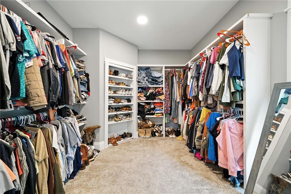 14430 Fincher Road Ball Ground, GA 30107 - Photo 37 of 51 a view of walk in closet with clothes