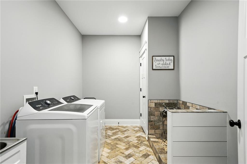 14430 Fincher Road Ball Ground, GA 30107 - Photo 38 of 51 a utility room with dryer and washer