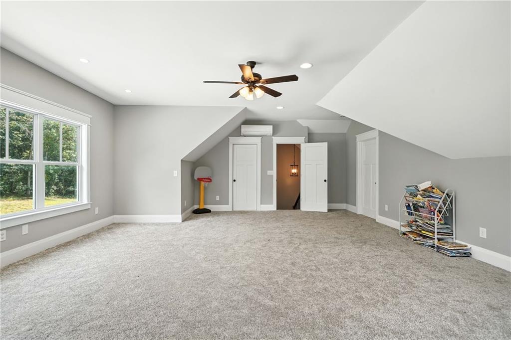 14430 Fincher Road Ball Ground, GA 30107 - Photo 47 of 51 an empty room with windows and fan