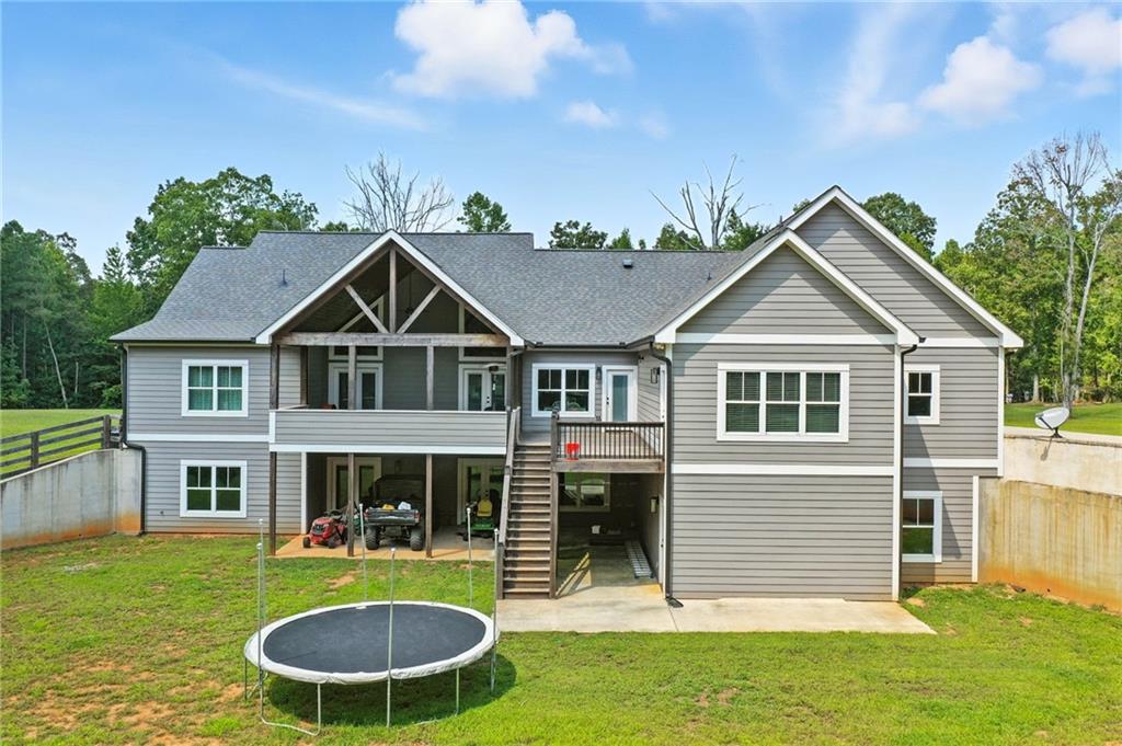 14430 Fincher Road Ball Ground, GA 30107 - Photo 9 of 51 a front view of house with yard and green space