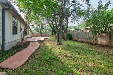 a backyard of a house with lots of green space