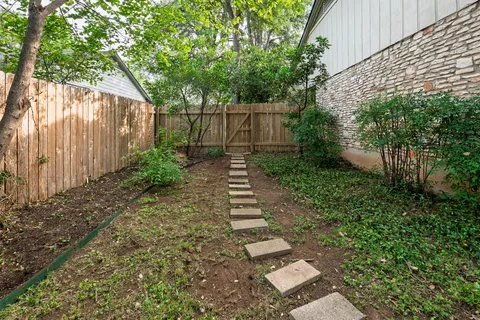 a backyard of a house with lots of green space