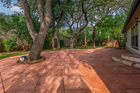 a backyard of a house with lots of green space