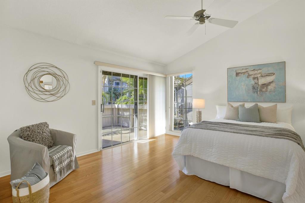 4684 West Huron Road St. Petersburg, FL 33708 - Photo 11 of 31 a spacious bedroom with a bed and glass window