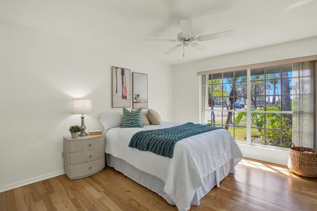 4684 West Huron Road St. Petersburg, FL 33708 - Photo 17 of 31 a bedroom with a bed and a large window