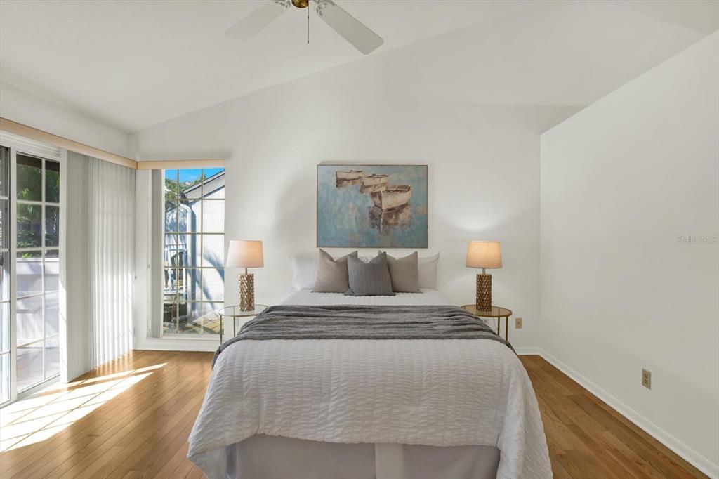 4684 West Huron Road St. Petersburg, FL 33708 - Photo 18 of 31 a bedroom with a bed and a night stand