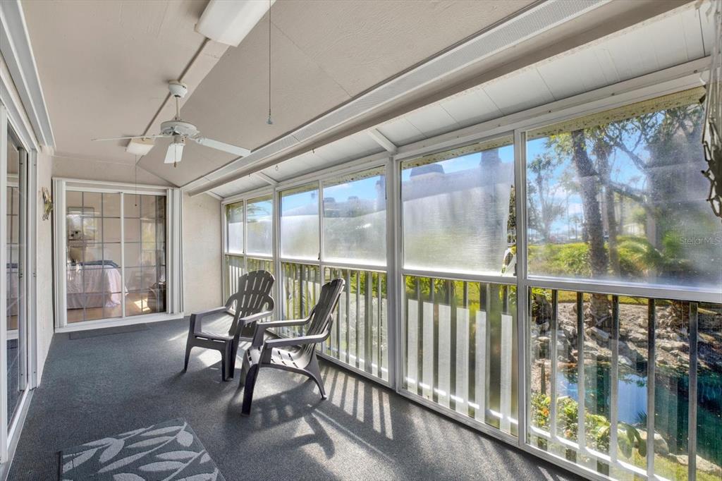 4684 West Huron Road St. Petersburg, FL 33708 - Photo 19 of 31 a view of a room with furniture and wooden floor
