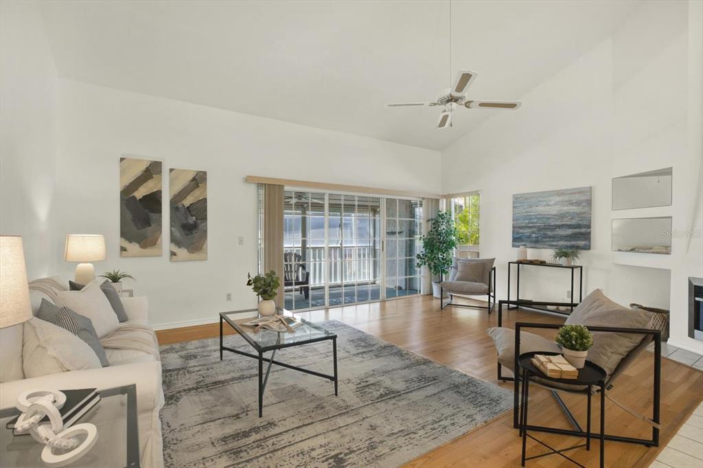4684 West Huron Road St. Petersburg, FL 33708 - Photo 2 of 31 a living room with furniture and a floor to ceiling window