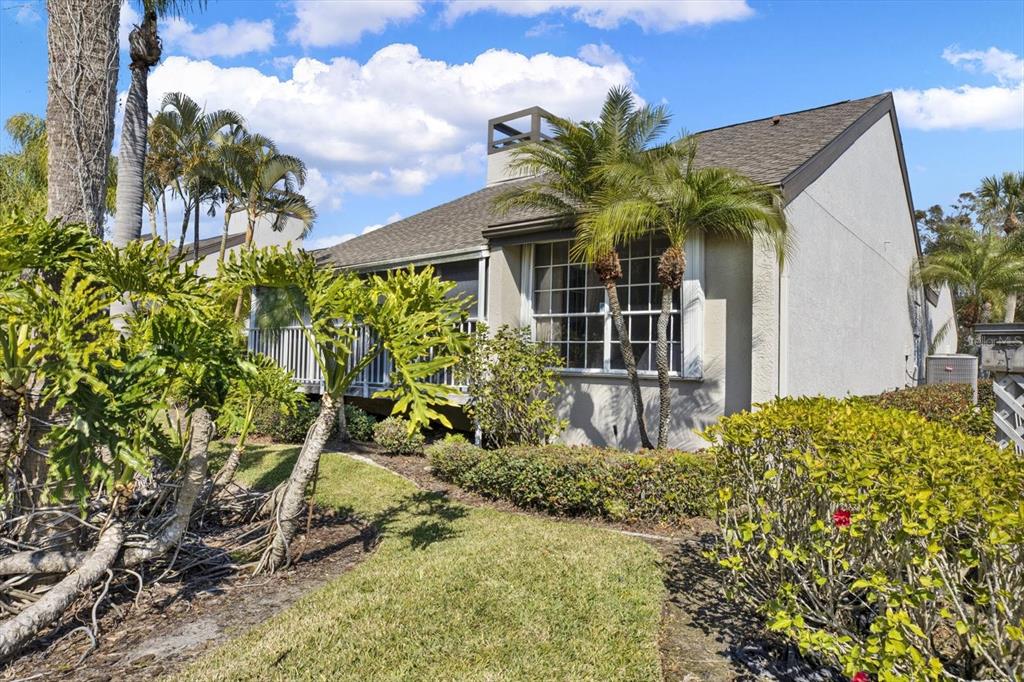 4684 West Huron Road St. Petersburg, FL 33708 - Photo 21 of 31 a front view of a house with a yard