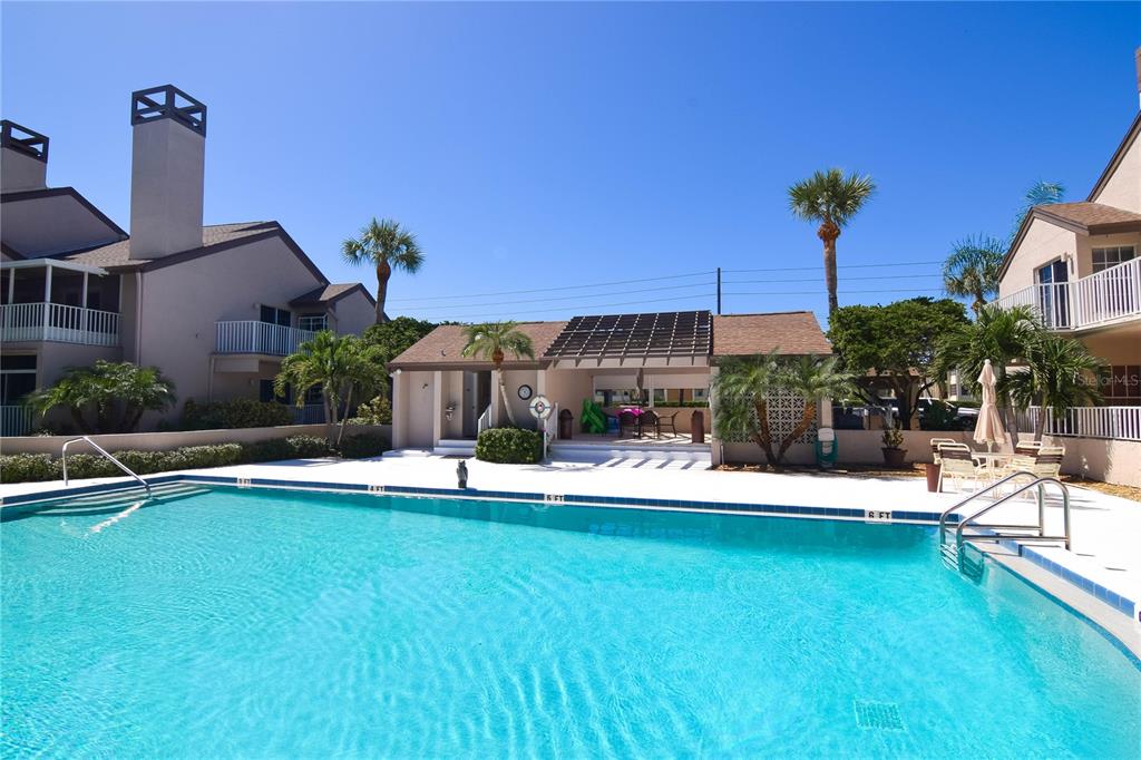 4684 West Huron Road St. Petersburg, FL 33708 - Photo 22 of 31 a view of a house with a yard porch and sitting area