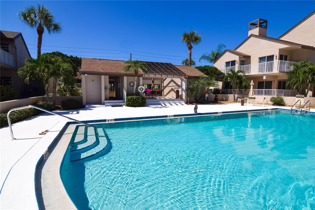 4684 West Huron Road St. Petersburg, FL 33708 - Photo 23 of 31 a view of a house with a yard