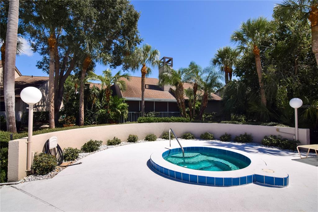 4684 West Huron Road St. Petersburg, FL 33708 - Photo 24 of 31 a front view of a house with garden