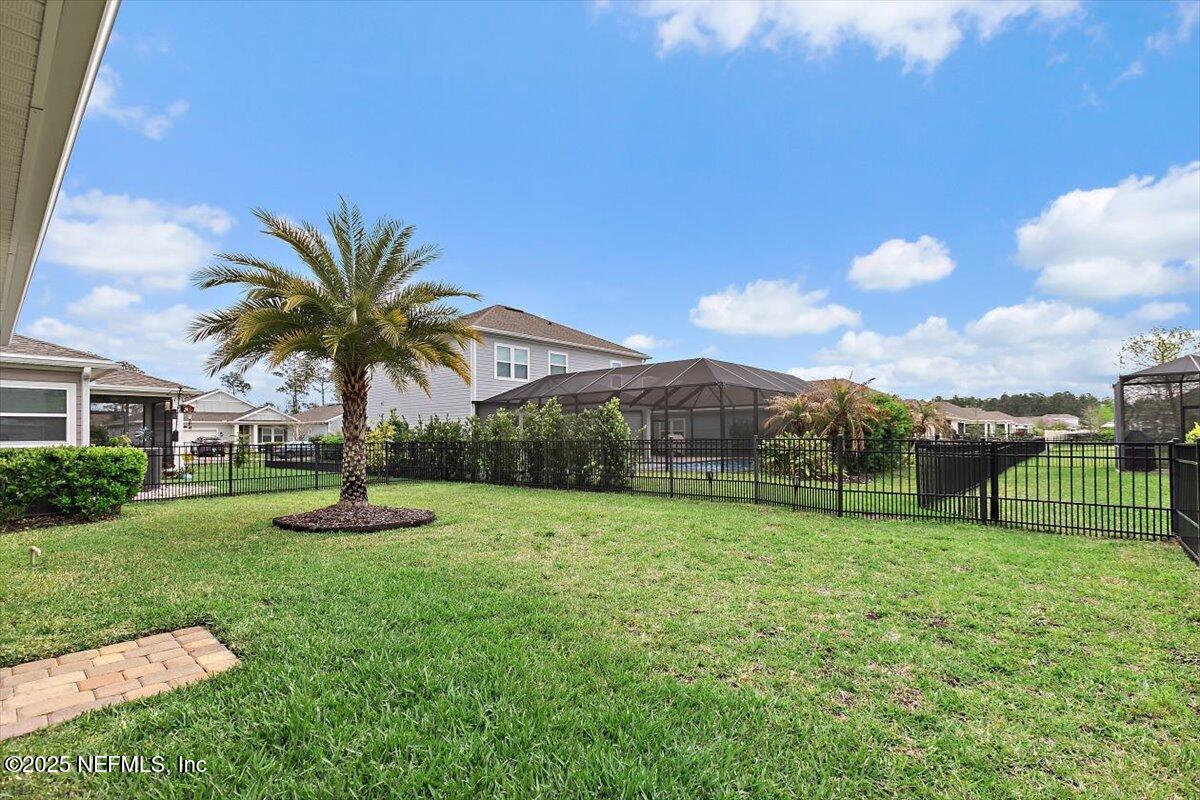 2661 Alexia Circle Jacksonville, FL 32246 - Photo 17 of 22 a view of a backyard with swimming pool and green space