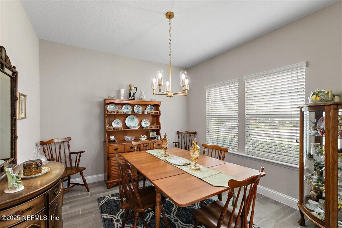 2661 Alexia Circle Jacksonville, FL 32246 - Photo 3 of 22 a view of a dining room with furniture and window