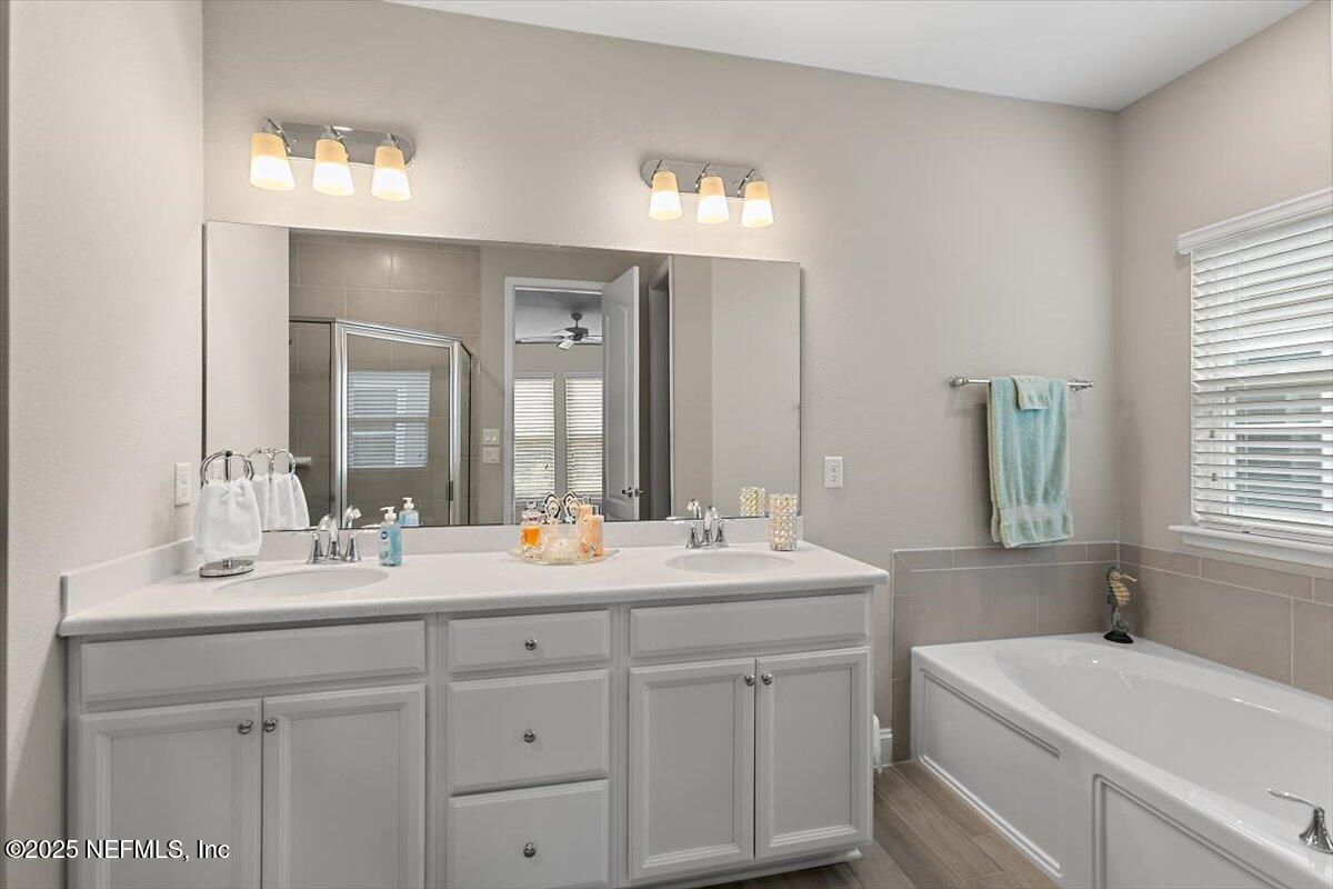 2661 Alexia Circle Jacksonville, FL 32246 - Photo 9 of 22 a bathroom with a double vanity sink mirror and double