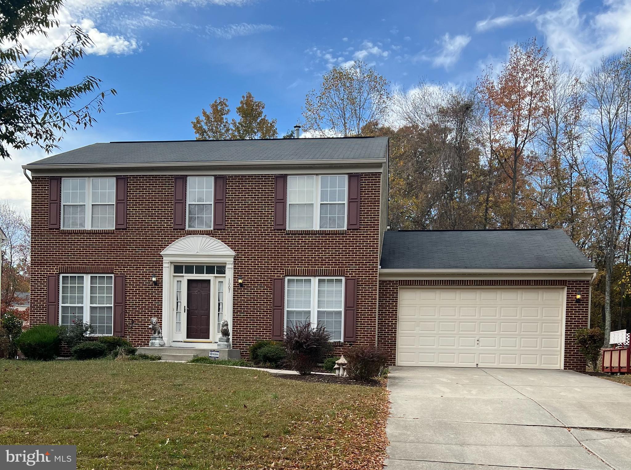 1007 Bohac Lane Accokeek, MD 20607 - Photo 1 of 22 a front view of a house with a yard and garage