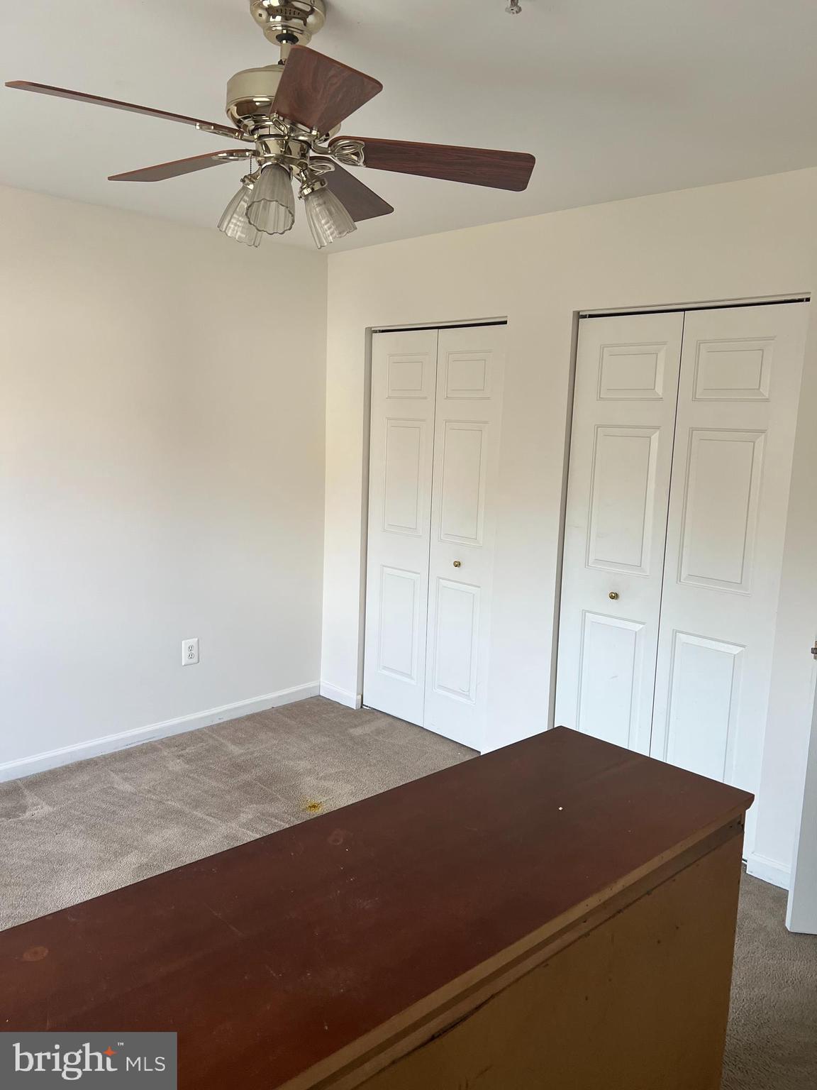 1007 Bohac Lane Accokeek, MD 20607 - Photo 22 of 22 a room with a bed and a ceiling fan