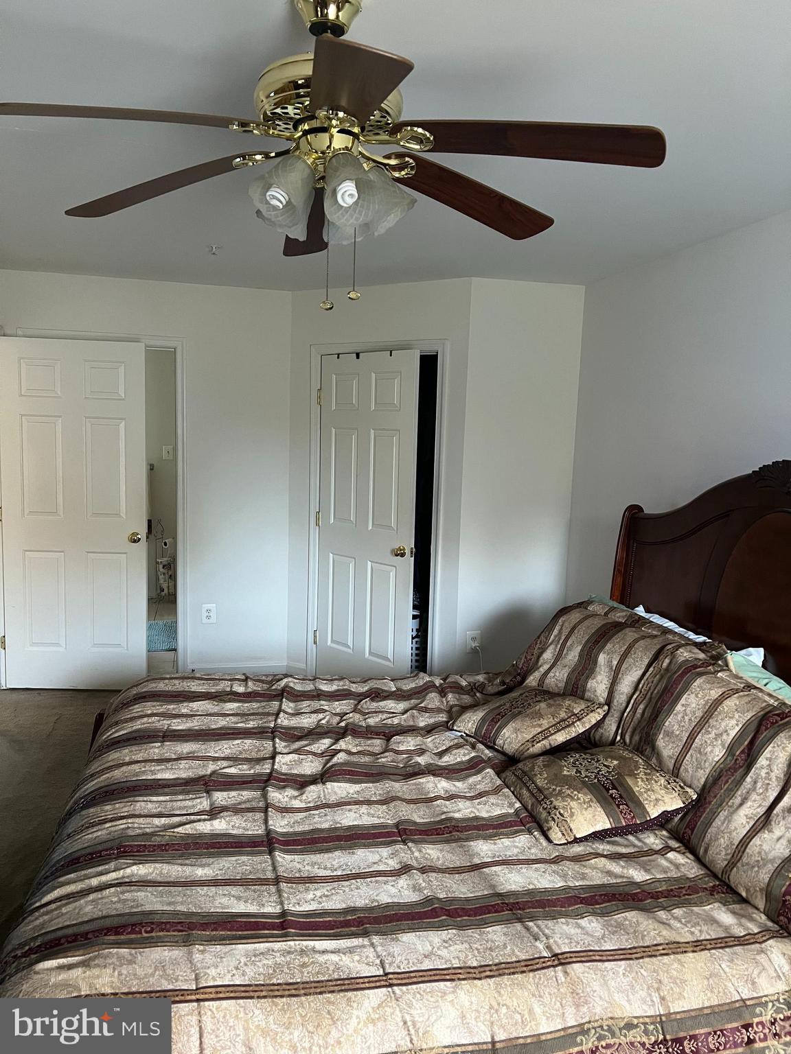 1007 Bohac Lane Accokeek, MD 20607 - Photo 10 of 22 a bedroom with a bed and a chandelier