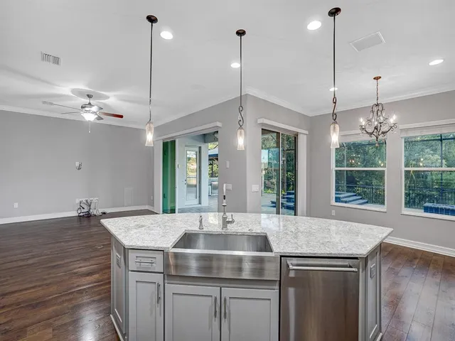 a view of a room with a door and a window
