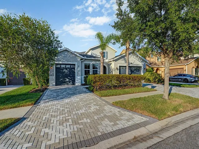 a view of kitchen with refrigerator and window