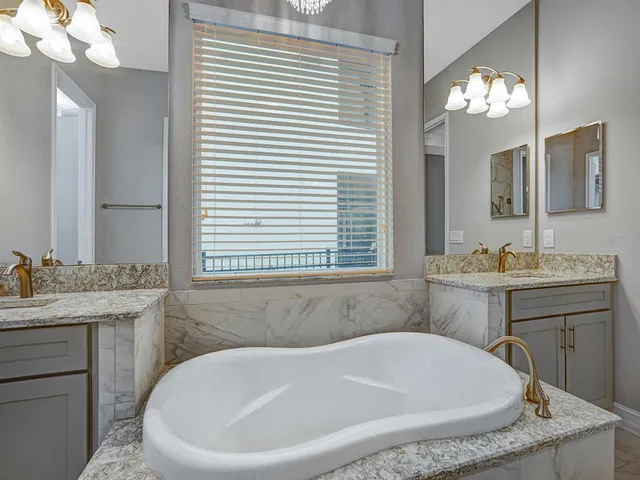 a view of a tub and chairs in the patio