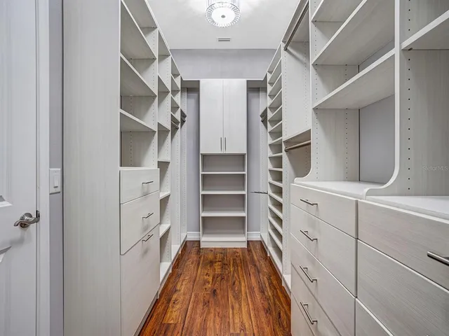 a view of a porch with furniture and next to a yard