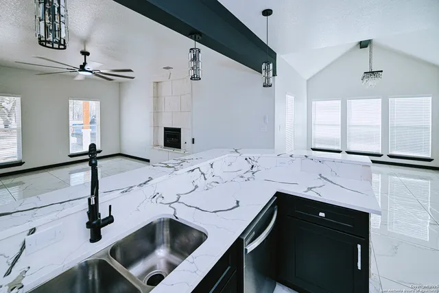 a bathroom with a sink double vanity and a mirror