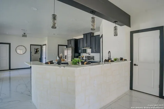 a view of living room and kitchen