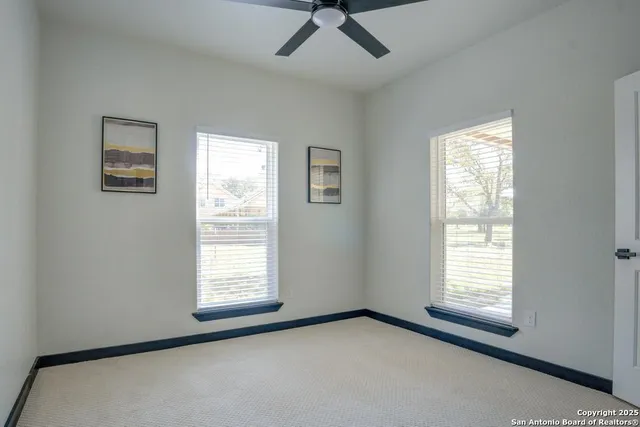 a view of a room that has a window in it