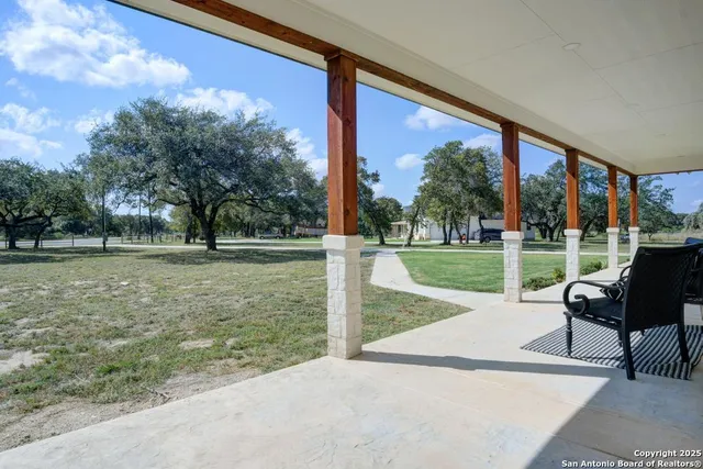 a view of a porch with a yard