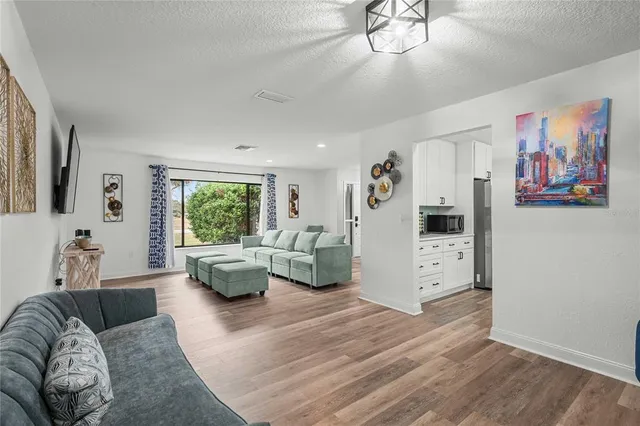 a living room with furniture and a large window