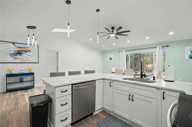 a very nice looking kitchen with a large window