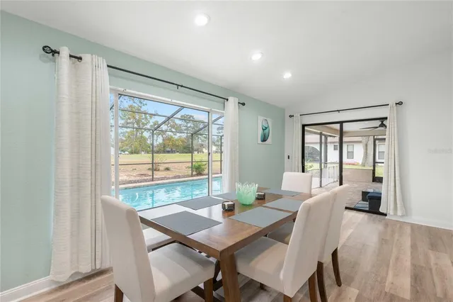 a view of a dining room with furniture window and outside view