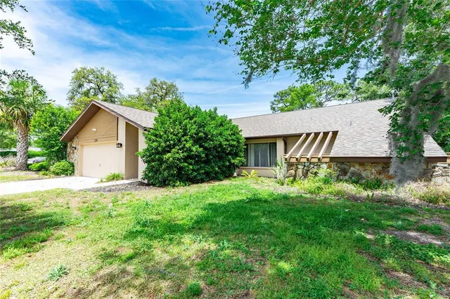 a house view with a garden space