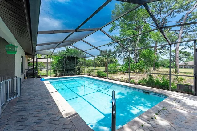 a view of swimming pool with seating area