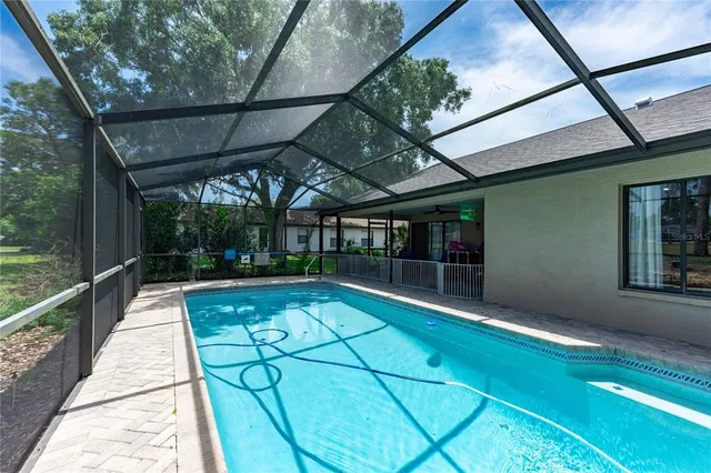 a view of swimming pool with a patio
