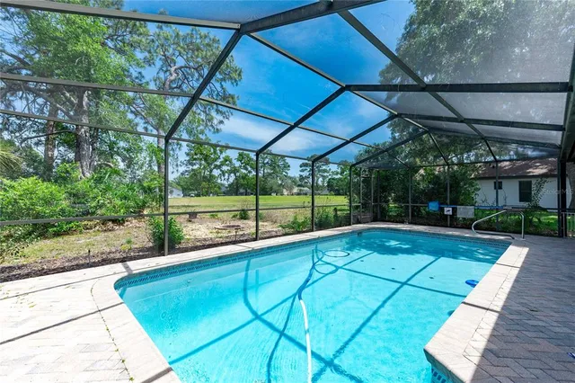a view of swimming pool with a patio