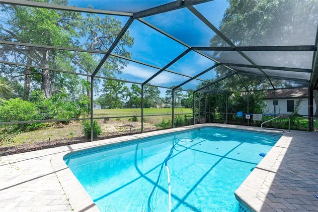 a view of swimming pool with a patio