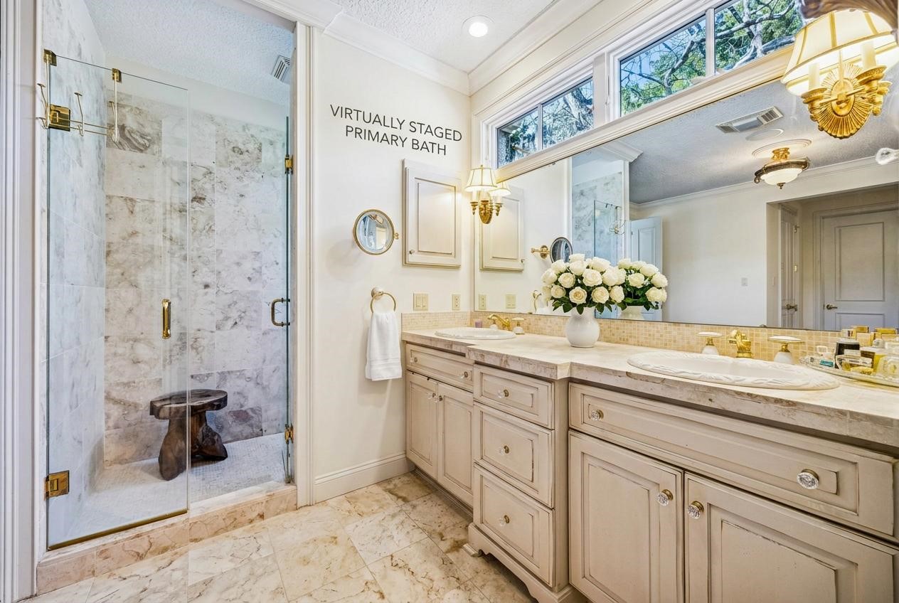 39 Marsh Creek Road Fernandina Beach, FL 32034 - Photo 27 of 78 a spacious bathroom with a granite countertop sink mirror and shower