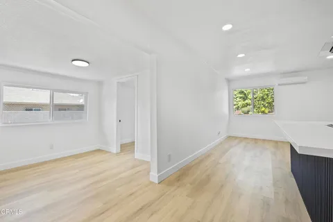 a view of kitchen and wooden floor