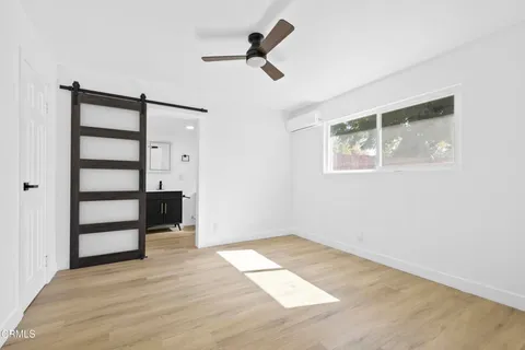 a bathroom with a toilet sink and shower