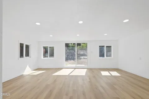 a kitchen with cabinets and window
