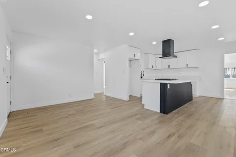 a view of kitchen with wooden floor