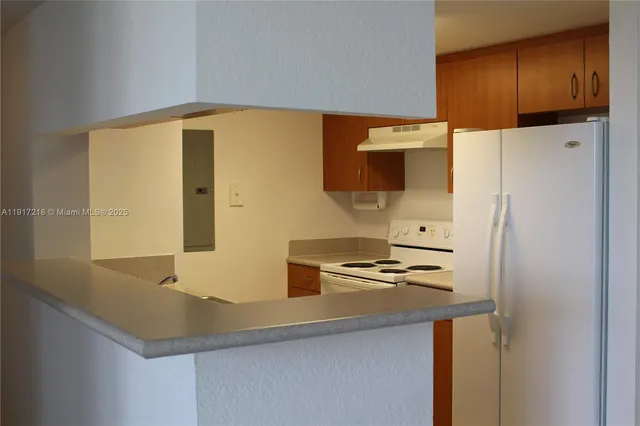 a bathroom with a sink and a large mirror