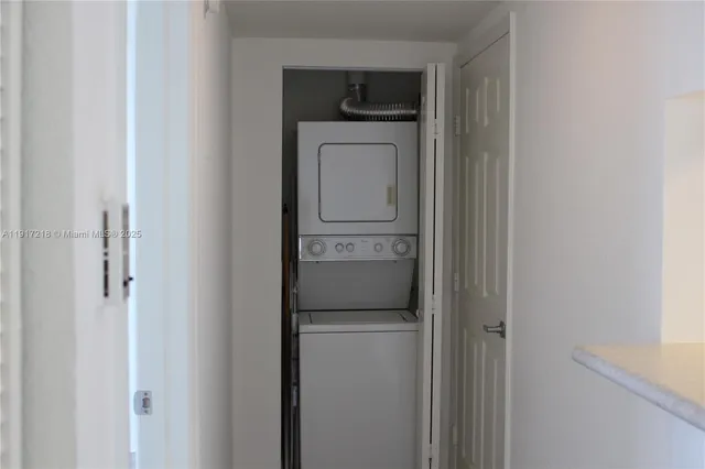a kitchen with a refrigerator and washer