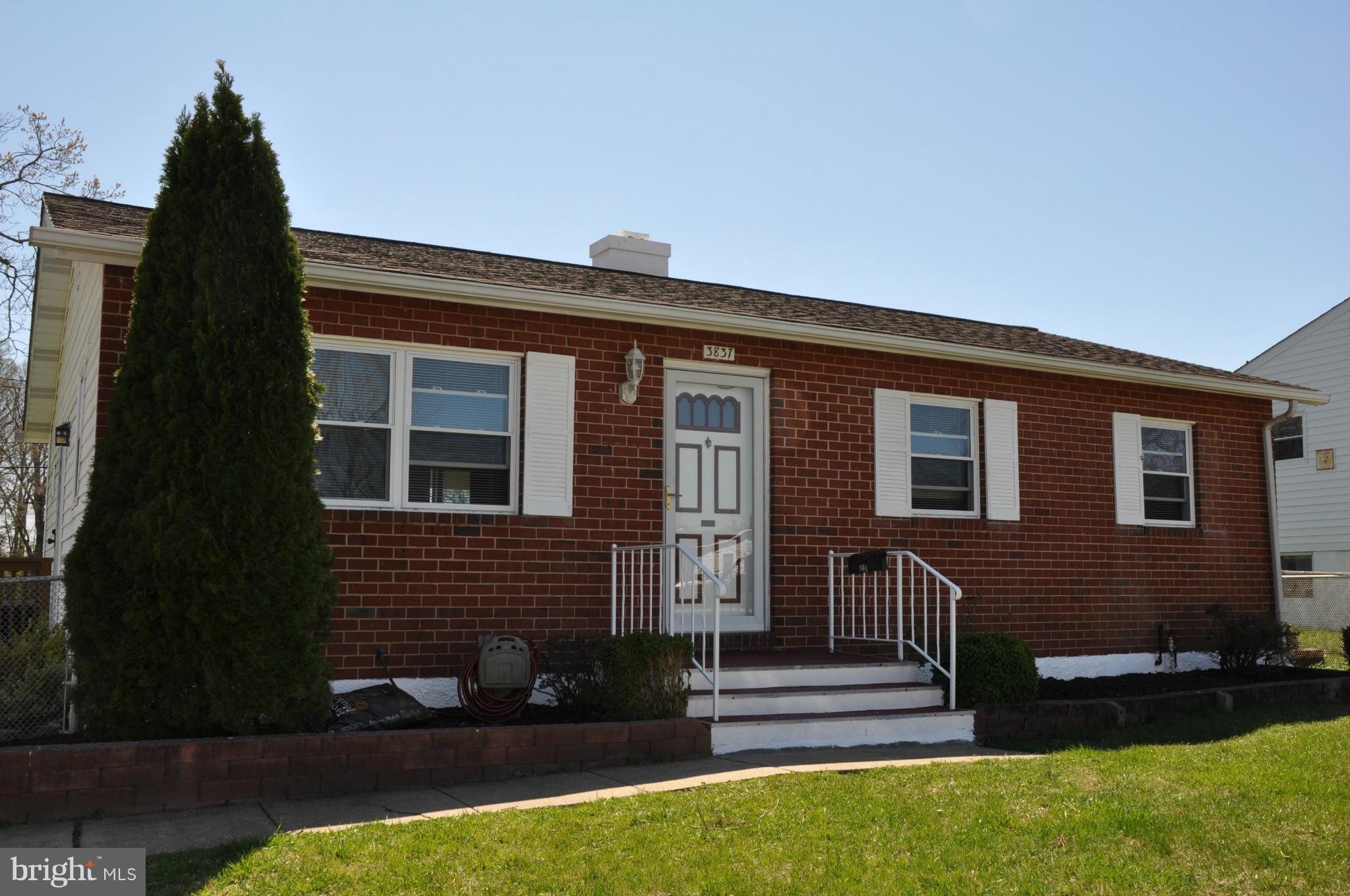 a front view of house with yard