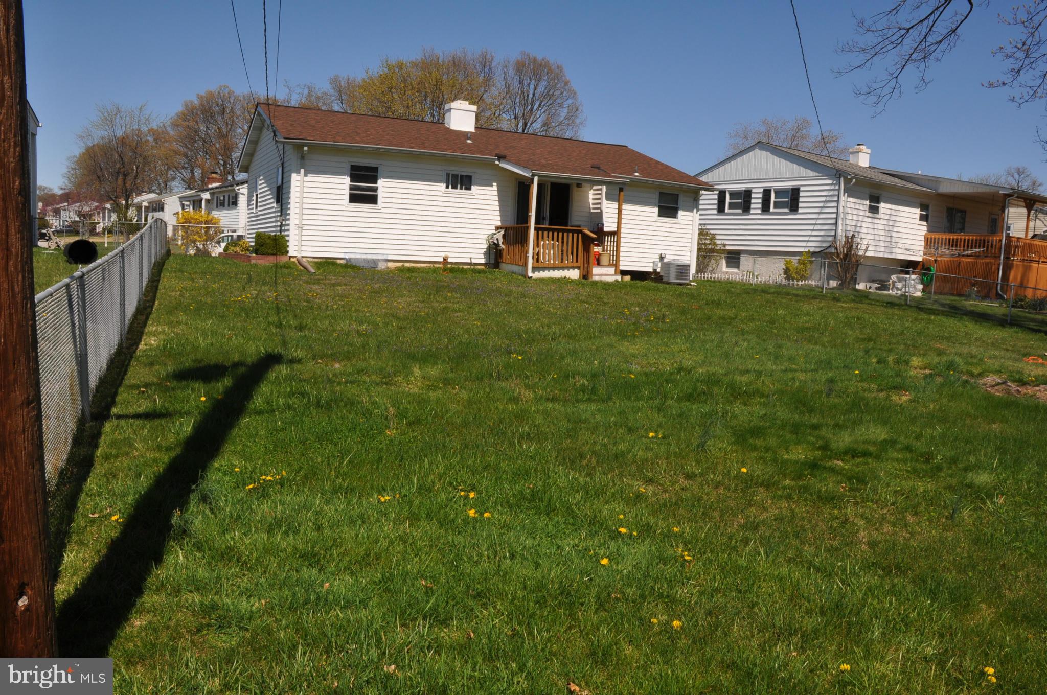 3837 Bayville Road Baltimore, MD 21220 - Photo 12 of 14 a front view of a house with a yard