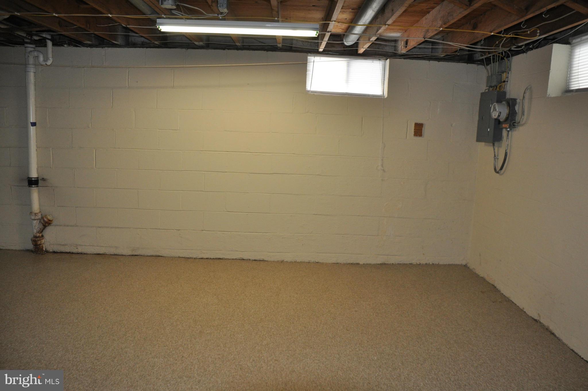 3837 Bayville Road Baltimore, MD 21220 - Photo 14 of 14 a view of a room with racks on the wall