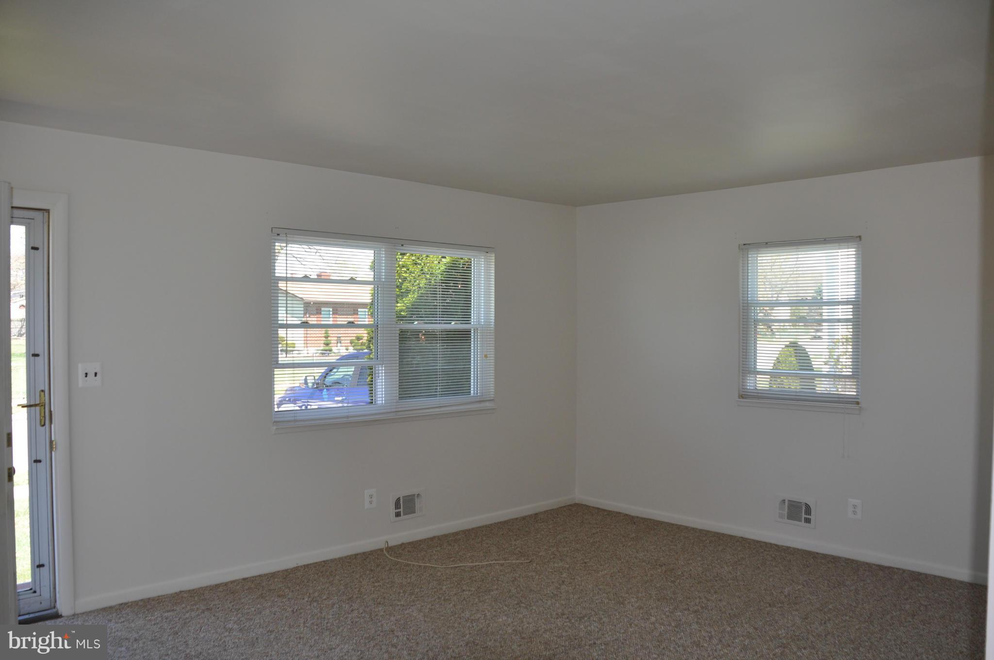 3837 Bayville Road Baltimore, MD 21220 - Photo 3 of 14 an empty room with windows